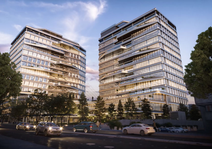 Twin glass buildings on busy city street